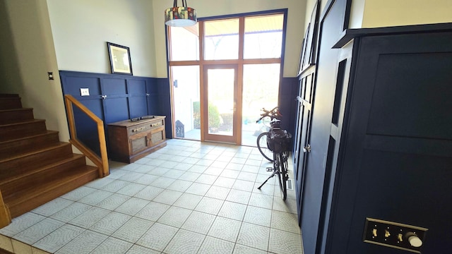 foyer entrance featuring light tile patterned floors