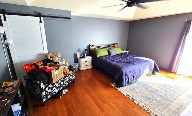 bedroom with ceiling fan and dark hardwood / wood-style floors