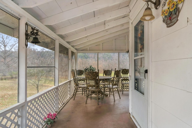 sunroom with vaulted ceiling with beams and wood ceiling