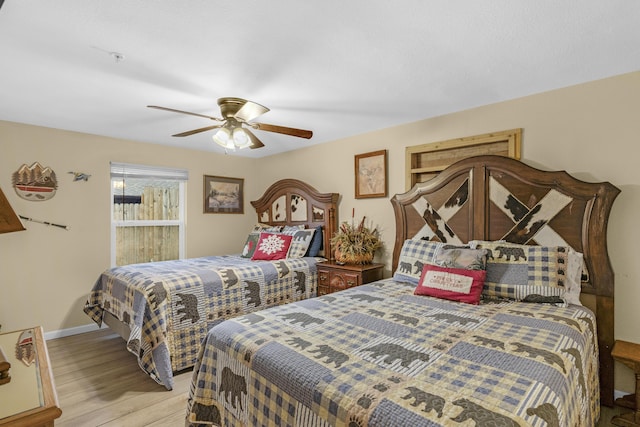 bedroom with ceiling fan and light hardwood / wood-style flooring