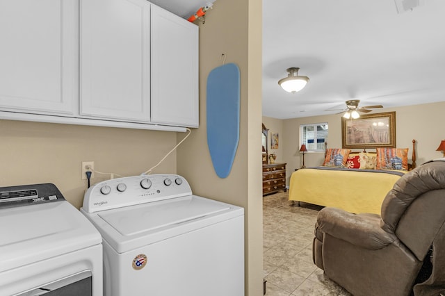 laundry area featuring ceiling fan, cabinets, and washing machine and clothes dryer