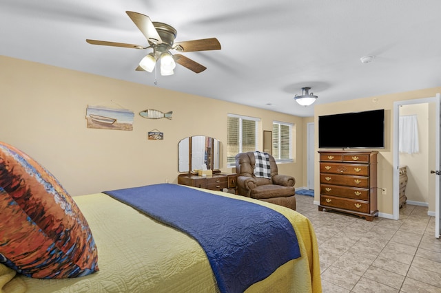 bedroom featuring ensuite bathroom and ceiling fan