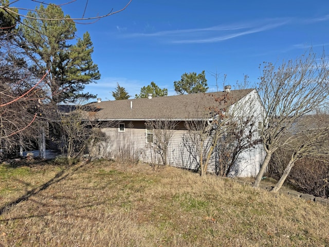 view of home's exterior with a yard