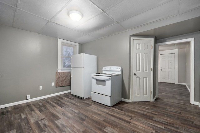 kitchen featuring a paneled ceiling, dark hardwood / wood-style flooring, and white appliances