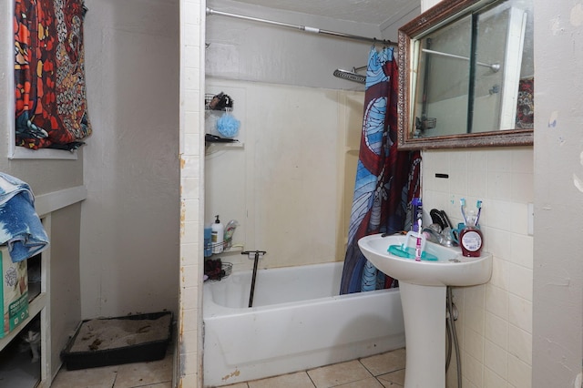 bathroom with tile patterned floors and shower / bath combo