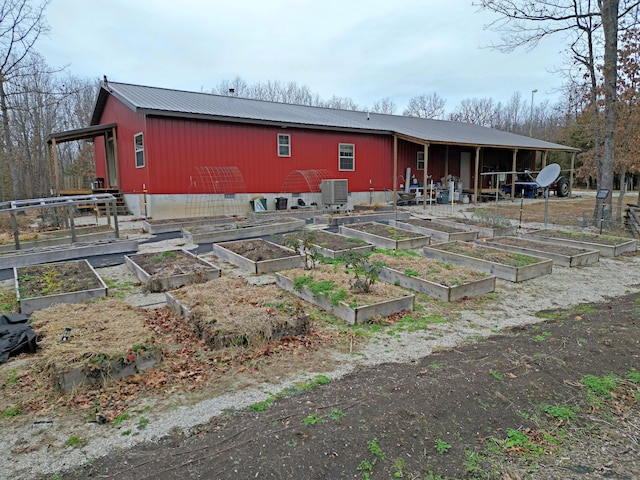 back of house featuring cooling unit