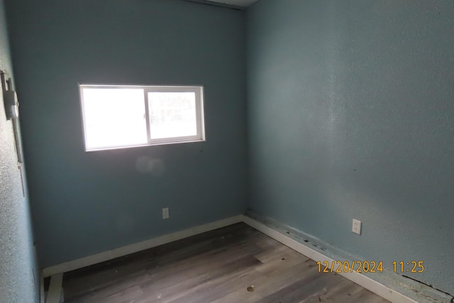 unfurnished room featuring hardwood / wood-style floors