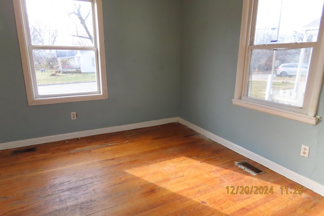 spare room featuring hardwood / wood-style floors