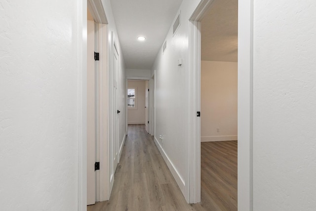 hall featuring light hardwood / wood-style flooring