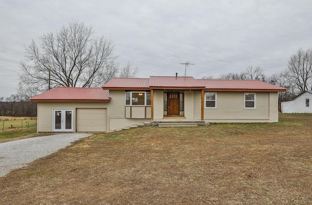 view of front of house featuring french doors and a front lawn