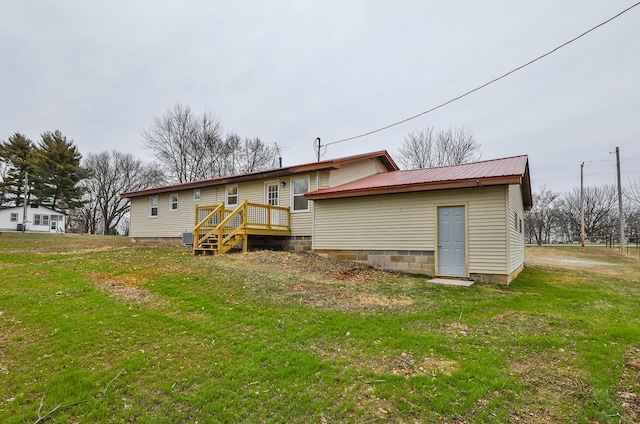 back of property with a lawn