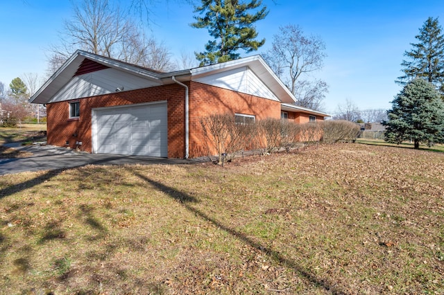 view of property exterior with a garage and a yard