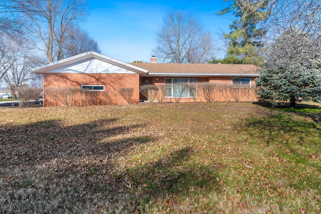 single story home featuring a front yard