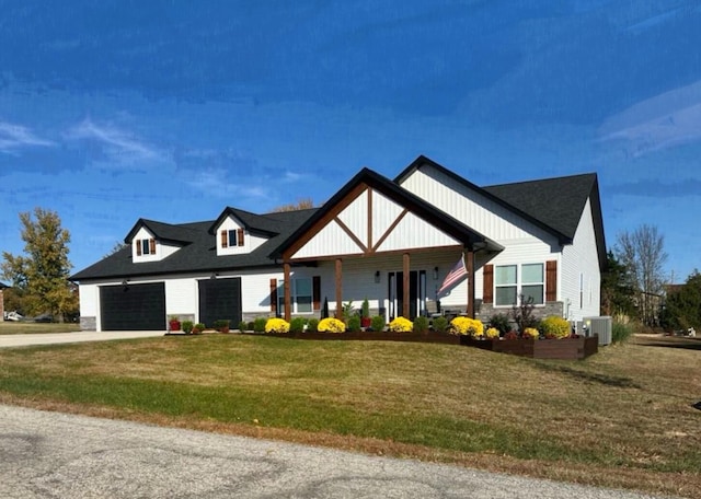 view of front of house with a front lawn, central AC unit, and a porch