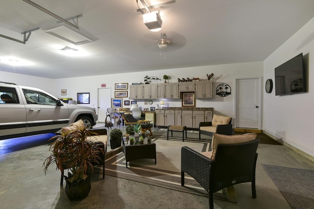 garage featuring ceiling fan and a garage door opener