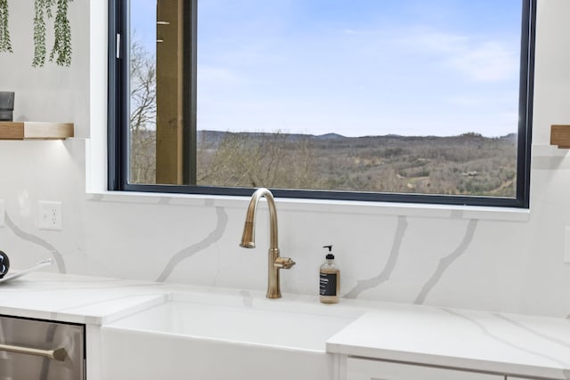 bathroom featuring a mountain view and sink