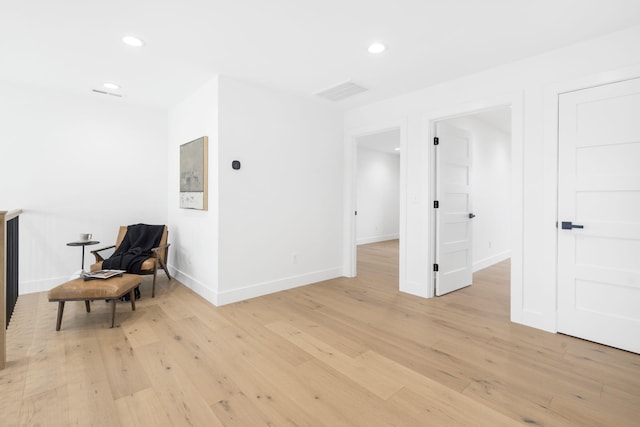 sitting room featuring light hardwood / wood-style flooring