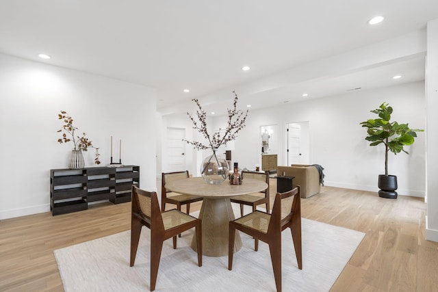 dining room with light hardwood / wood-style flooring