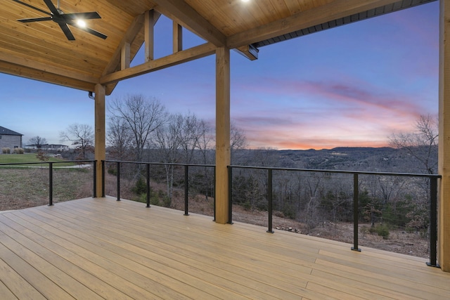 deck at dusk with ceiling fan