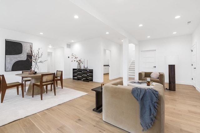 living room with light hardwood / wood-style flooring