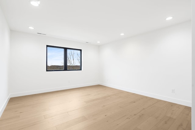 unfurnished room with light hardwood / wood-style floors