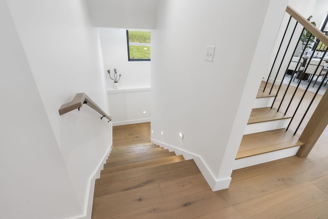 stairway featuring hardwood / wood-style flooring