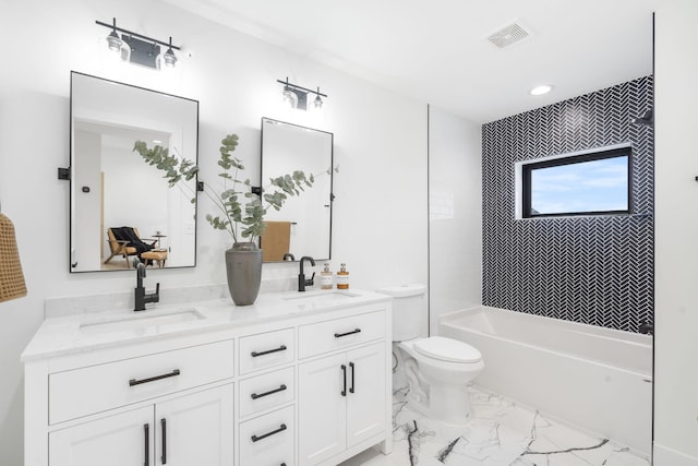 full bathroom with vanity, toilet, and tiled shower / bath combo