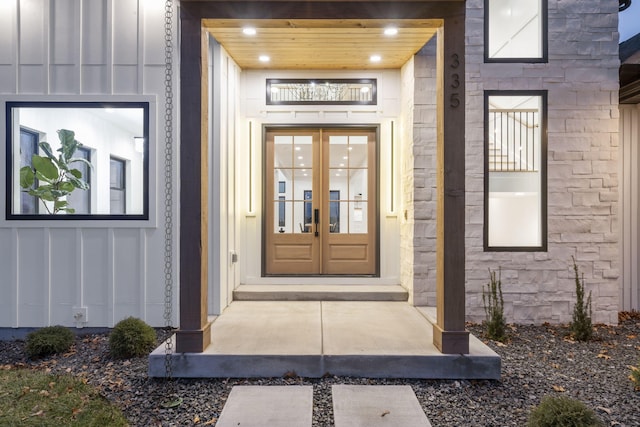 view of exterior entry featuring french doors