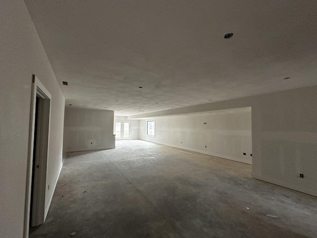 spare room featuring concrete flooring