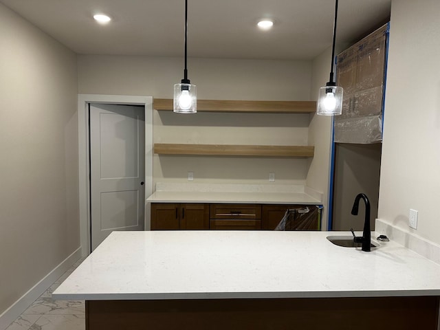 kitchen with hanging light fixtures and sink