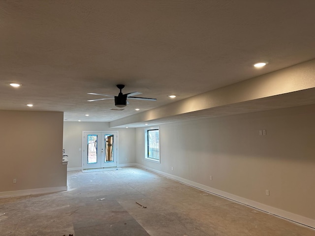 unfurnished room featuring ceiling fan and french doors