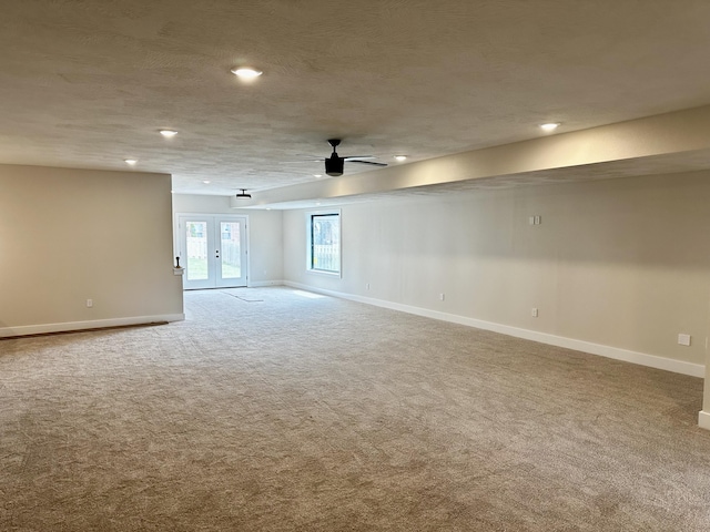 empty room with baseboards, ceiling fan, carpet flooring, and recessed lighting