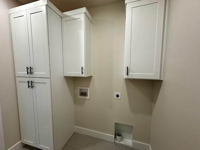 laundry area with baseboards, hookup for an electric dryer, washer hookup, and tile patterned floors