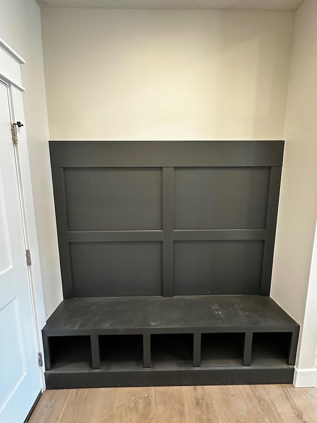 mudroom with wood finished floors