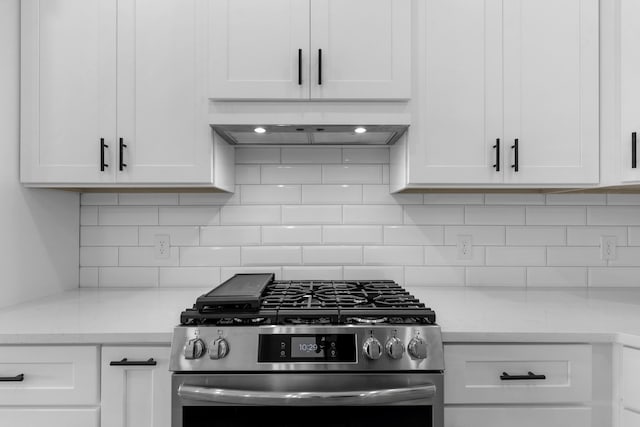 702 S Thornridge Dr, Springfield, MO 65809 - kitchen with gas stove, premium range hood, light countertops, and white cabinets