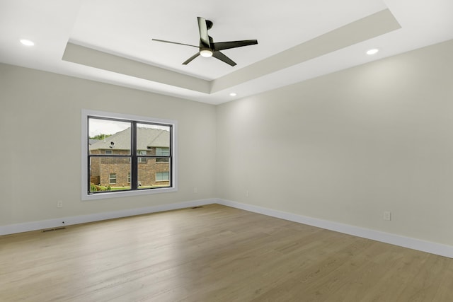 702 S Thornridge Dr, Springfield, MO 65809 - unfurnished room featuring a tray ceiling, a ceiling fan, light wood-style flooring, recessed lighting, and baseboards