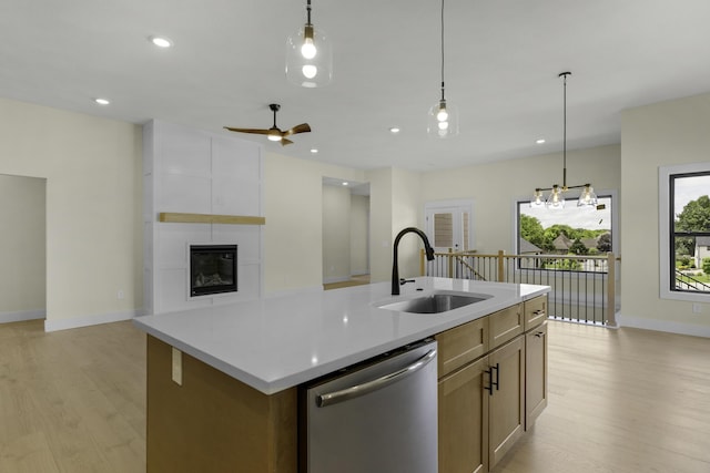 702 S Thornridge Dr, Springfield, MO 65809 - kitchen with dishwasher, a sink, light wood-style flooring, baseboards, and recessed lighting