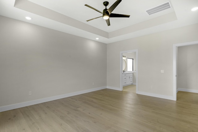 702 S Thornridge Dr, Springfield, MO 65809 - unfurnished room with a raised ceiling, ceiling fan, baseboards, recessed lighting, and light wood-type flooring
