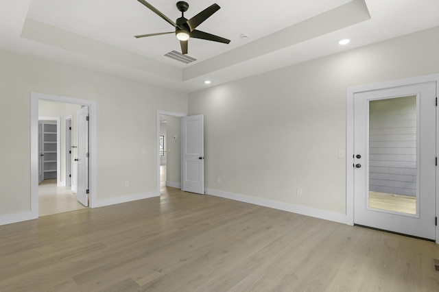702 S Thornridge Dr, Springfield, MO 65809 - spare room with a raised ceiling, a ceiling fan, recessed lighting, light wood finished floors, and baseboards