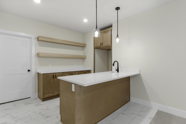 702 S Thornridge Dr, Springfield, MO 65809 - kitchen with light marble finish flooring, baseboards, a peninsula, recessed lighting, and decorative light fixtures