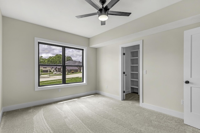 702 S Thornridge Dr, Springfield, MO 65809 - unfurnished bedroom featuring carpet, baseboards, a spacious closet, and ceiling fan