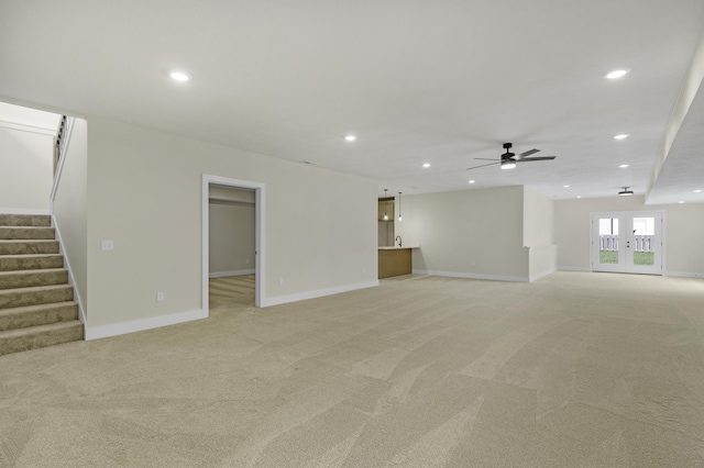 702 S Thornridge Dr, Springfield, MO 65809 - unfurnished living room featuring light colored carpet, recessed lighting, a ceiling fan, stairway, and baseboards