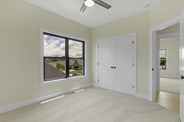 702 S Thornridge Dr, Springfield, MO 65809 - unfurnished bedroom featuring light carpet, baseboards, a closet, and a ceiling fan