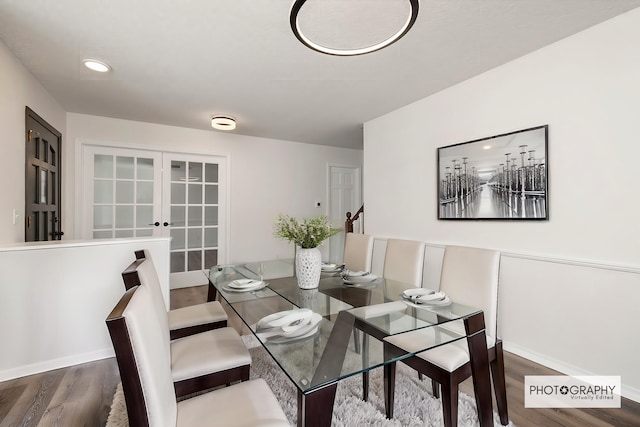 dining room featuring dark wood-type flooring and french doors