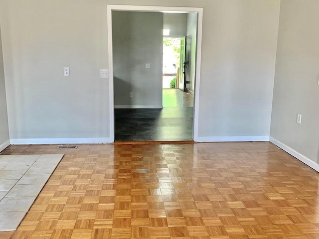 spare room featuring light parquet floors