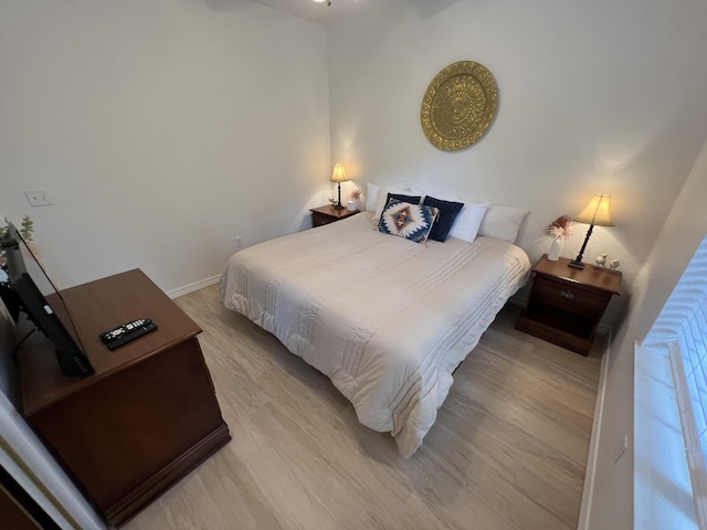 bedroom with light wood-type flooring