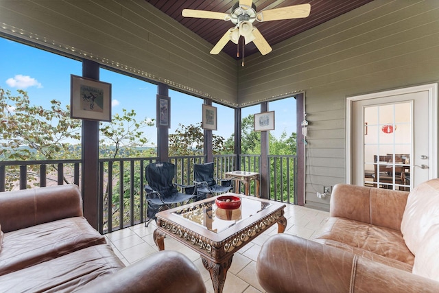 sunroom / solarium featuring ceiling fan and wood ceiling