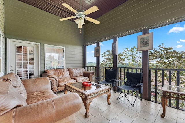 sunroom / solarium featuring ceiling fan and wooden ceiling