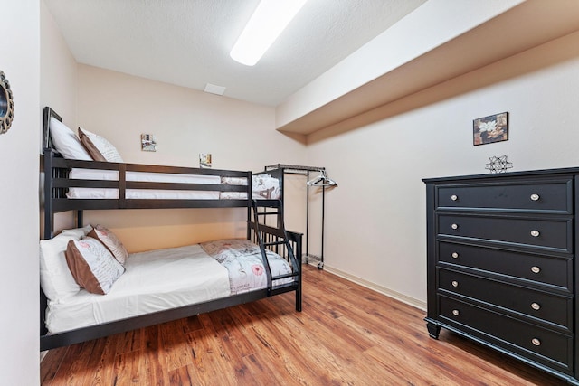 bedroom with light hardwood / wood-style floors