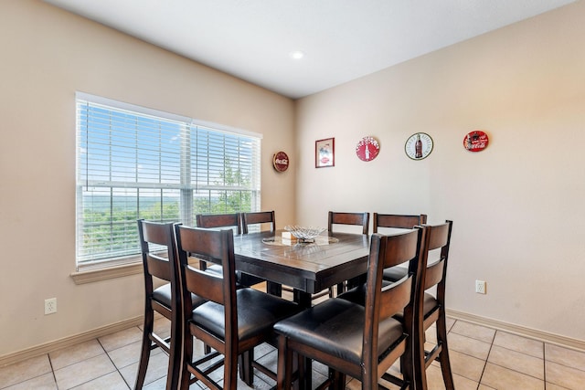 dining space with light tile patterned flooring